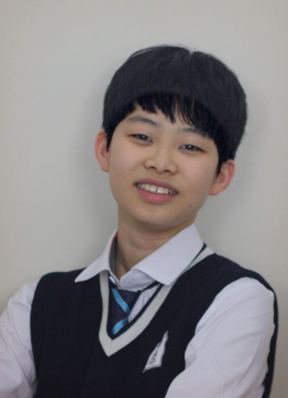 Portrait of Mark Ahn smiling, wearing a school uniform